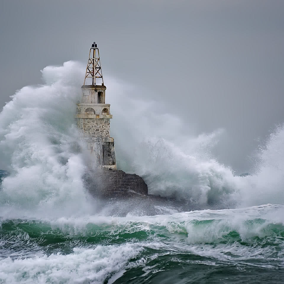 Waves crashing on a lighthouse